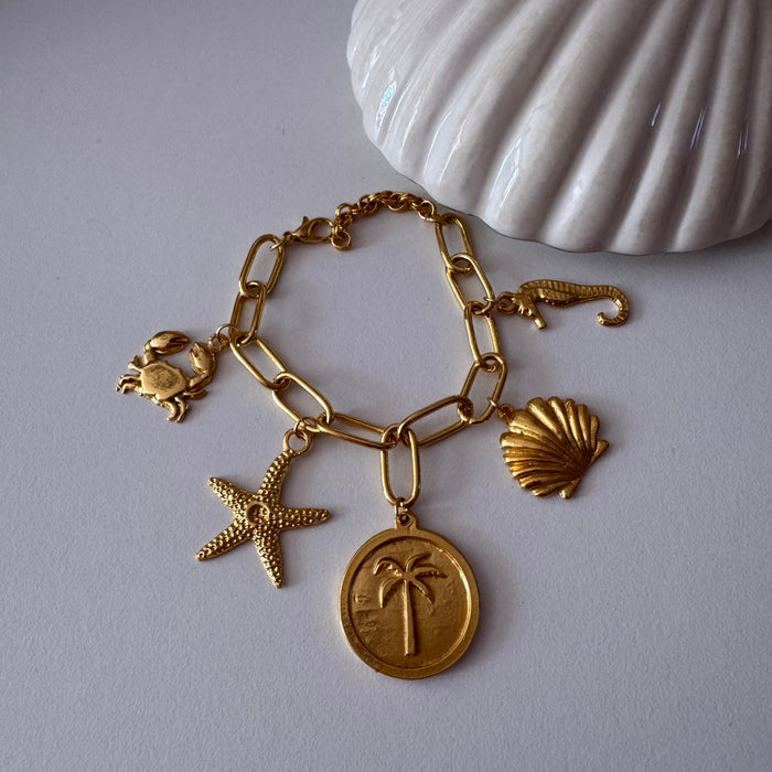 Bracelet en or rempli de coquillages