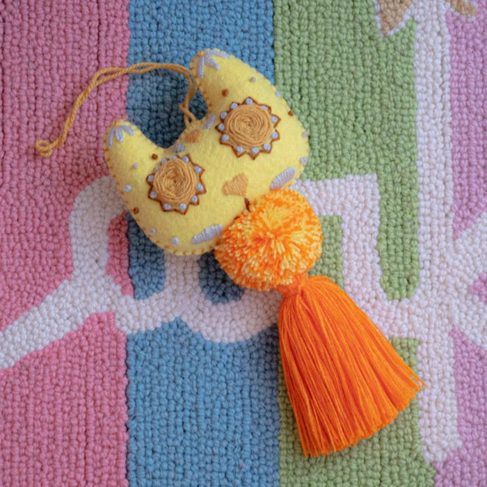 Yellow Cat With Orange Pompom Tassel