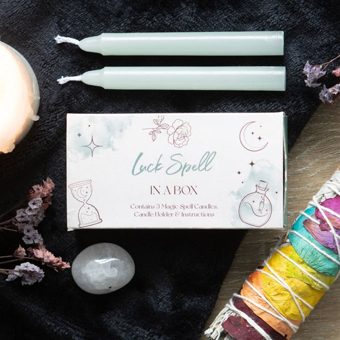 Bougies de rituel de manifestation dans une boîte